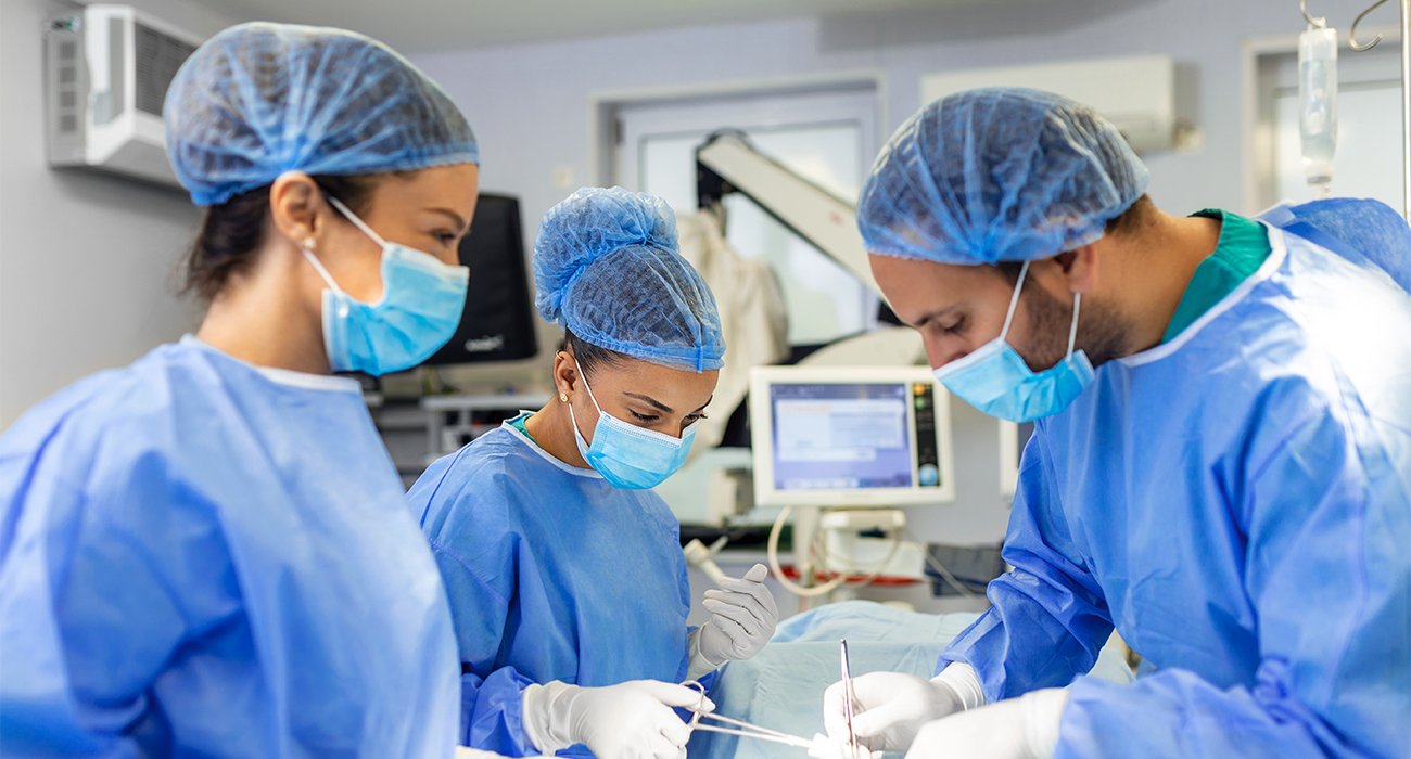 A medical illustration of the TAVI (Transcatheter Aortic Valve Implantation) procedure, showing a new valve being placed without open-heart surgery.